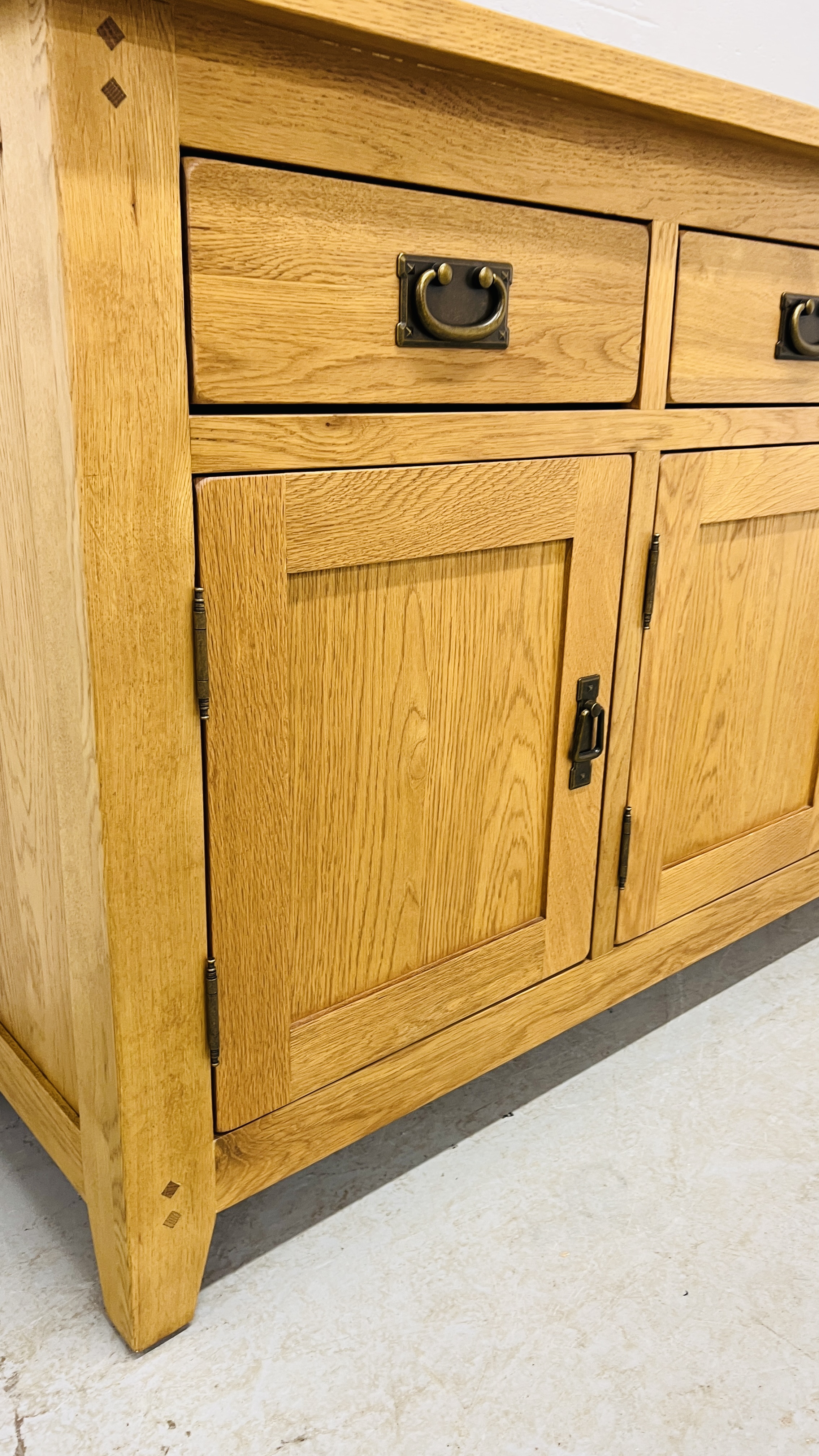 MODERN OAK THREE DRAWER THREE DOOR SIDEBOARD WITH BRASS EFFECT HANDLES WIDTH 139CM. DEPTH 42CM. - Image 10 of 13