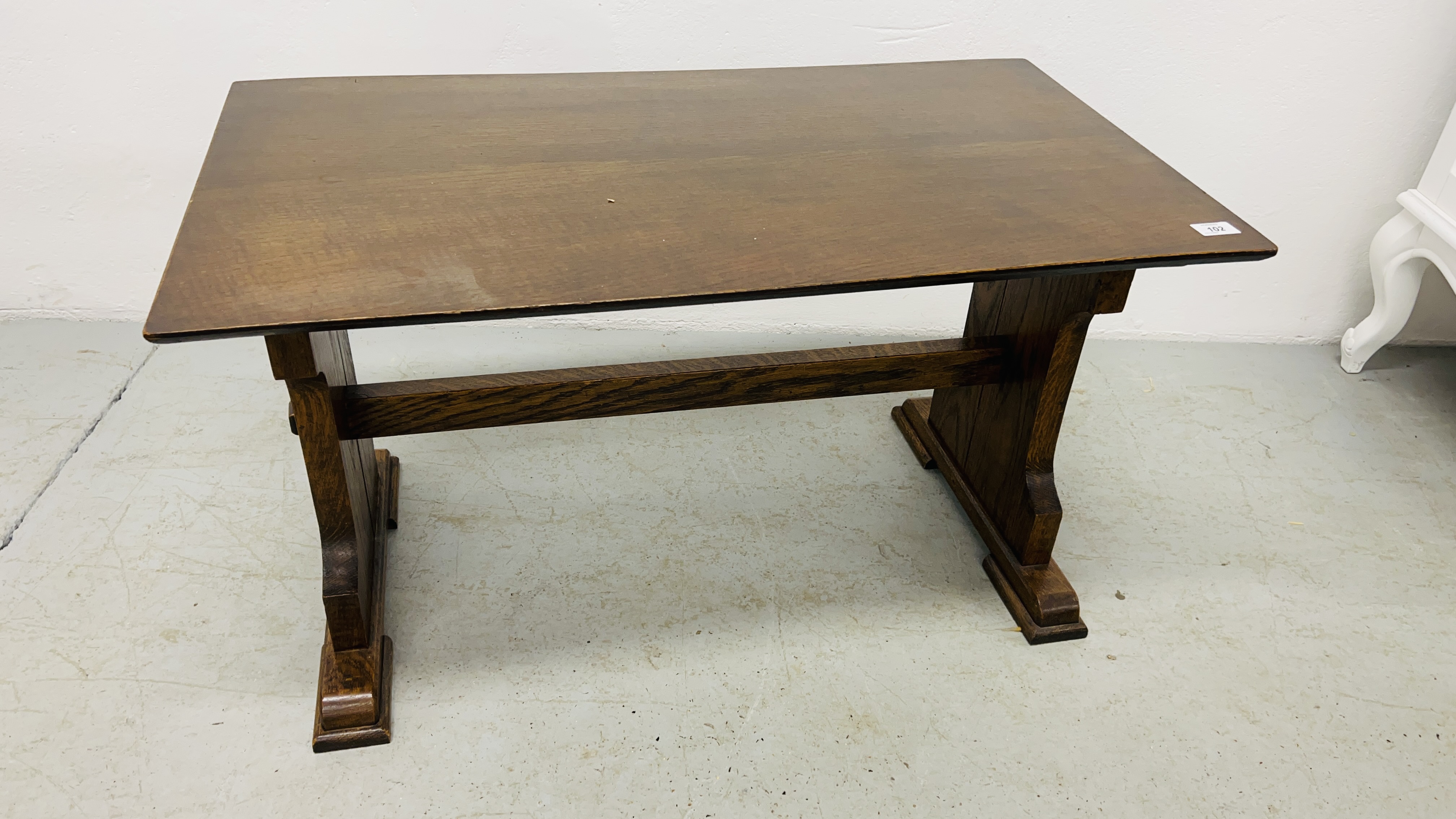 A SOLID OAK REFECTORY STYLE COFFEE TABLE WIDTH 50CM. LENGTH 89CM. HEIGHT 50CM.