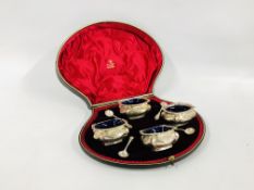 A CASED SET OF FOUR SALTS WITH BLUE GLASS LINERS,