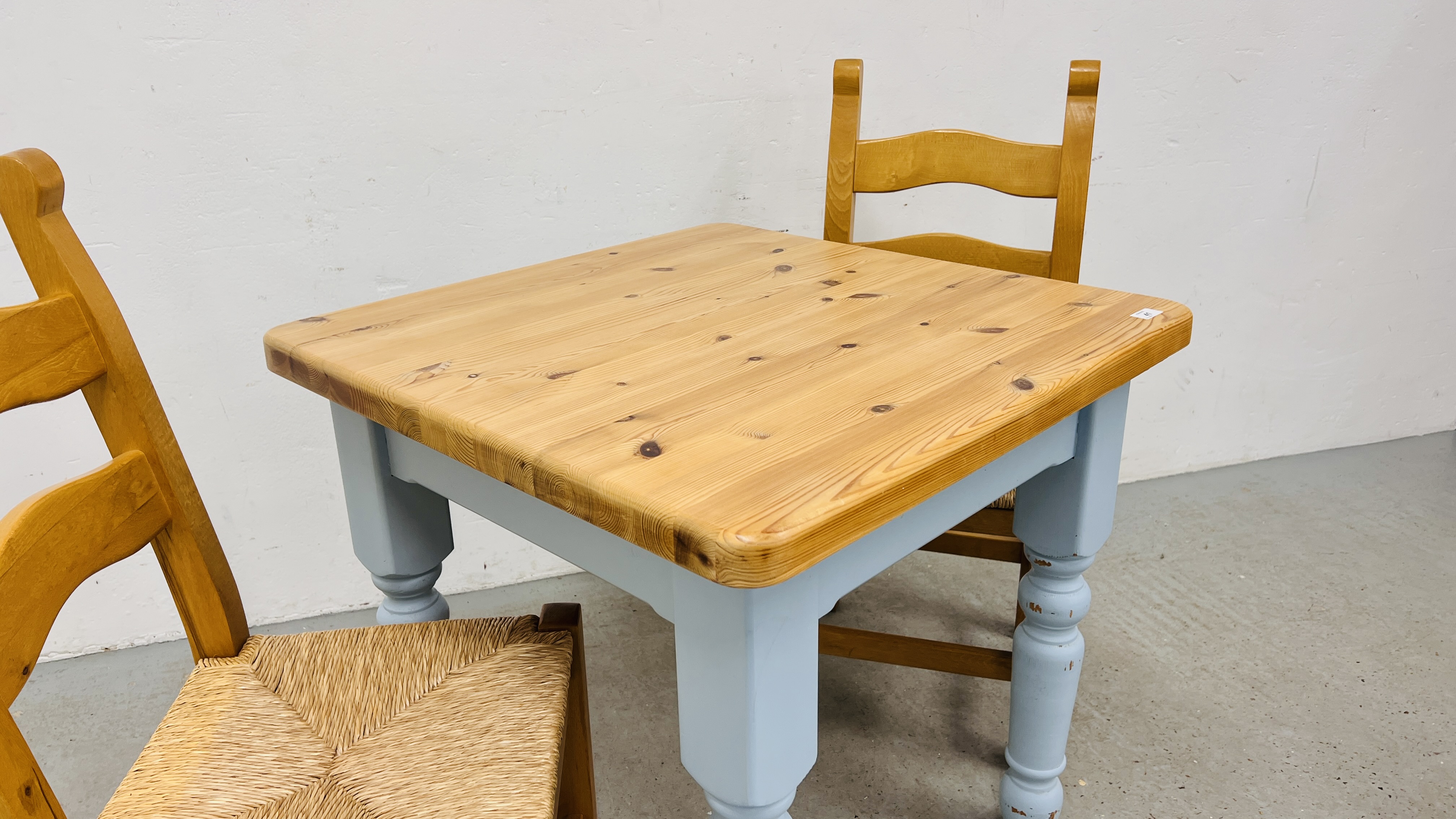 A SOLID PINE BREAKFAST TABLE WITH NATURAL WAXED FINISH TOP AND TWO SOLID BEECHWOOD DINING CHAIRS - Image 8 of 8