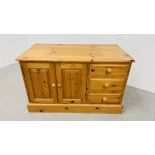 A SOLID WAXED PINE THREE DRAWER ENTERTAINMENT CABINET WIDTH 107CM. DEPTH 54CM. HEIGHT 65CM.