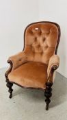 A VICTORIAN MAHOGANY FRAMED BUTTON BACK LADIES CHAIR.