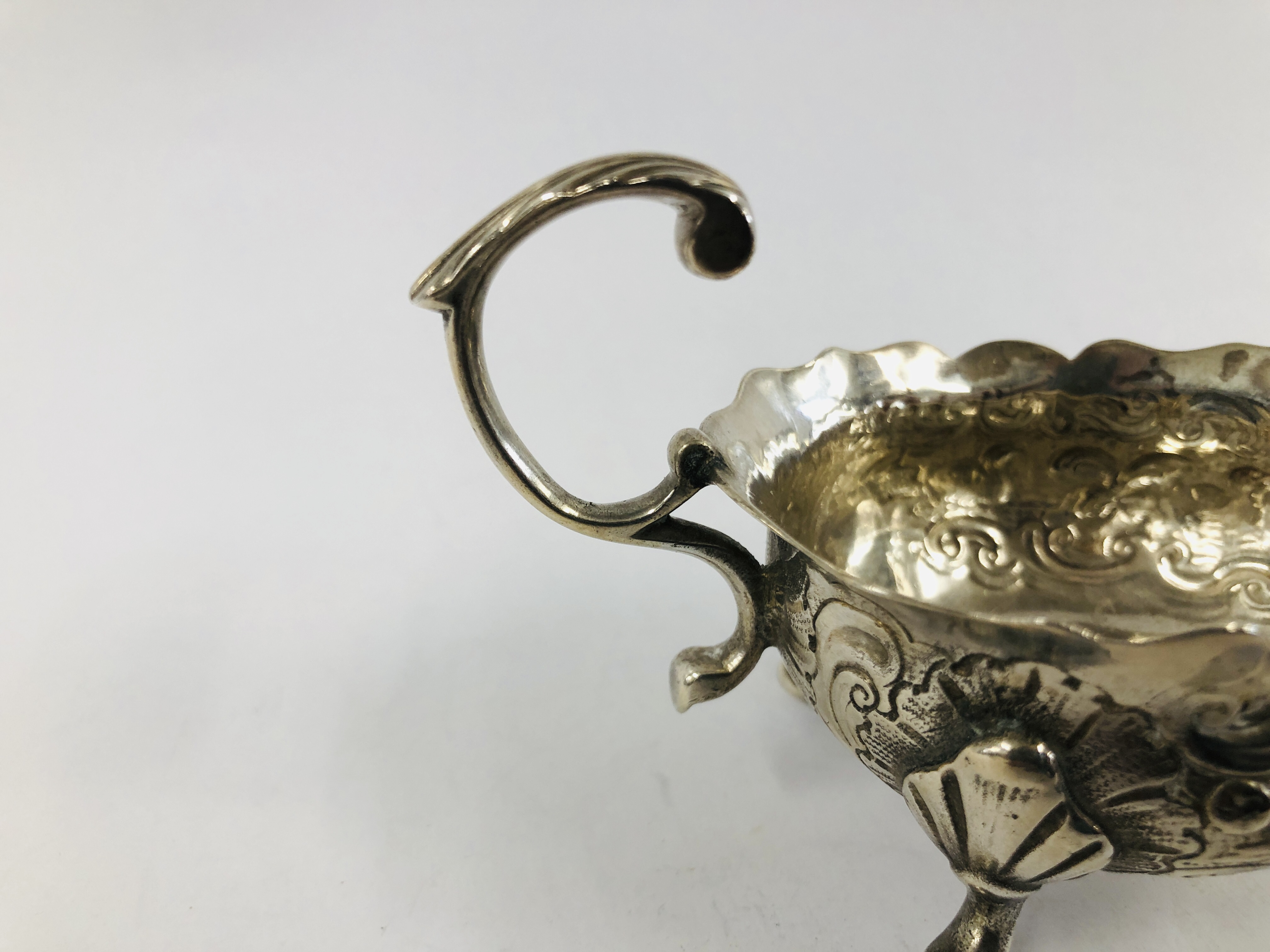 A GEORGE II SILVER CREAM BOAT WITH OPEN SCROLLED HANDLE THE BODY DECORATED WITH GEESE ON TRIPOD - Image 4 of 10