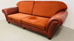 A TETRA EASTWOOD RED LEATHER AND UPHOLSTERED SOFA WITH STUD DETAIL, W 250CM.