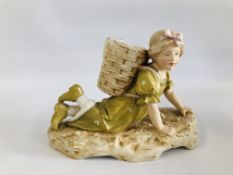 A ROYAL DUX FIGURE OF A PROSTRATE GIRL WITH GRAPE PICKERS BASKET HEIGHT 19CM.