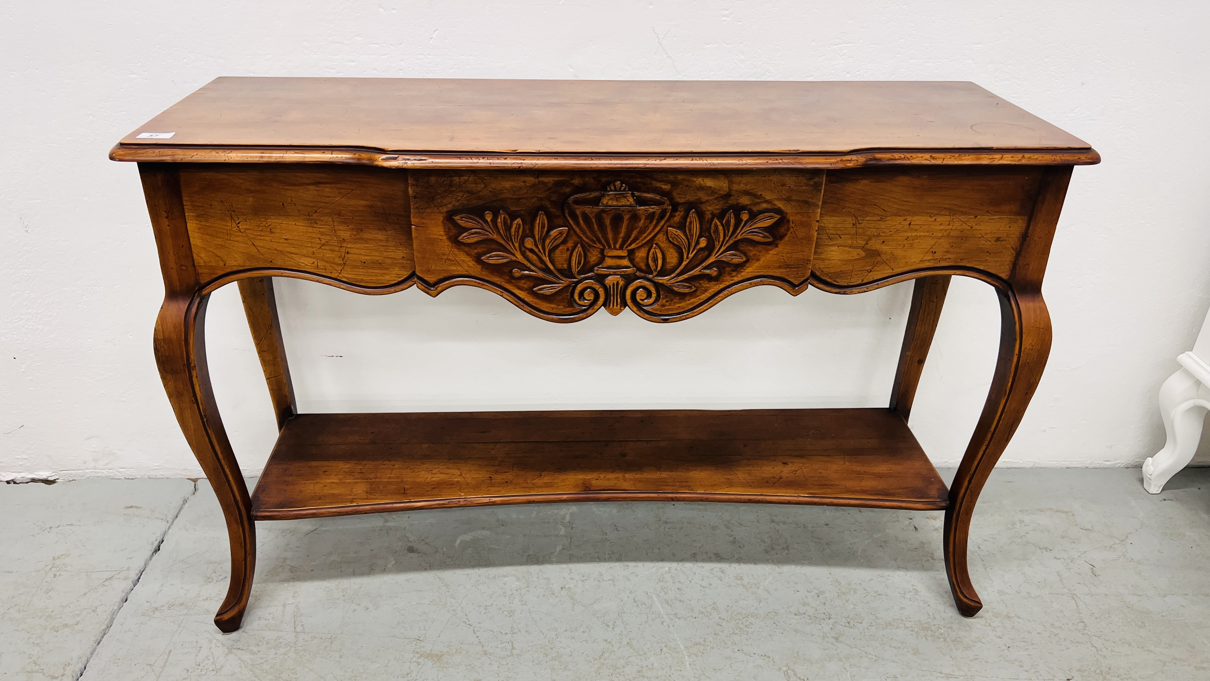 REPRODUCTION MAHOGANY SIDE TABLE WITH CENTRAL CONCEALED DRAWER AND SHELF BELOW WIDTH 118CM.