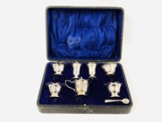 A CASED CONDIMENT SET COMPRISING TWO PAIRS SALTS, BLUE GLASS LINERS,