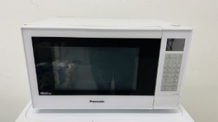 A PANASONIC INVERTER MICROWAVE OVEN WITH INSTRUCTION BOOK - SOLD AS SEEN