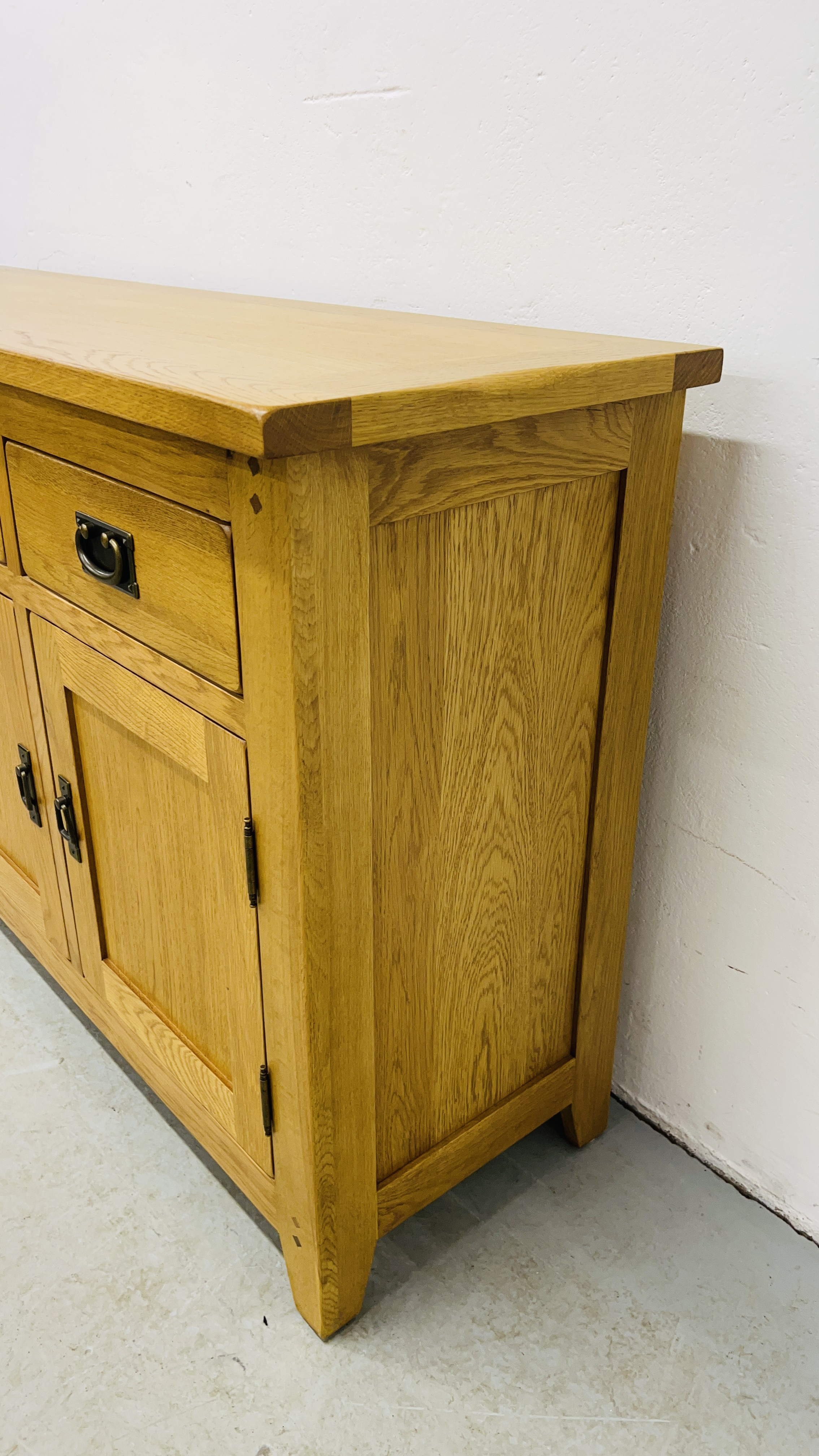 MODERN OAK THREE DRAWER THREE DOOR SIDEBOARD WITH BRASS EFFECT HANDLES WIDTH 139CM. DEPTH 42CM. - Image 4 of 13