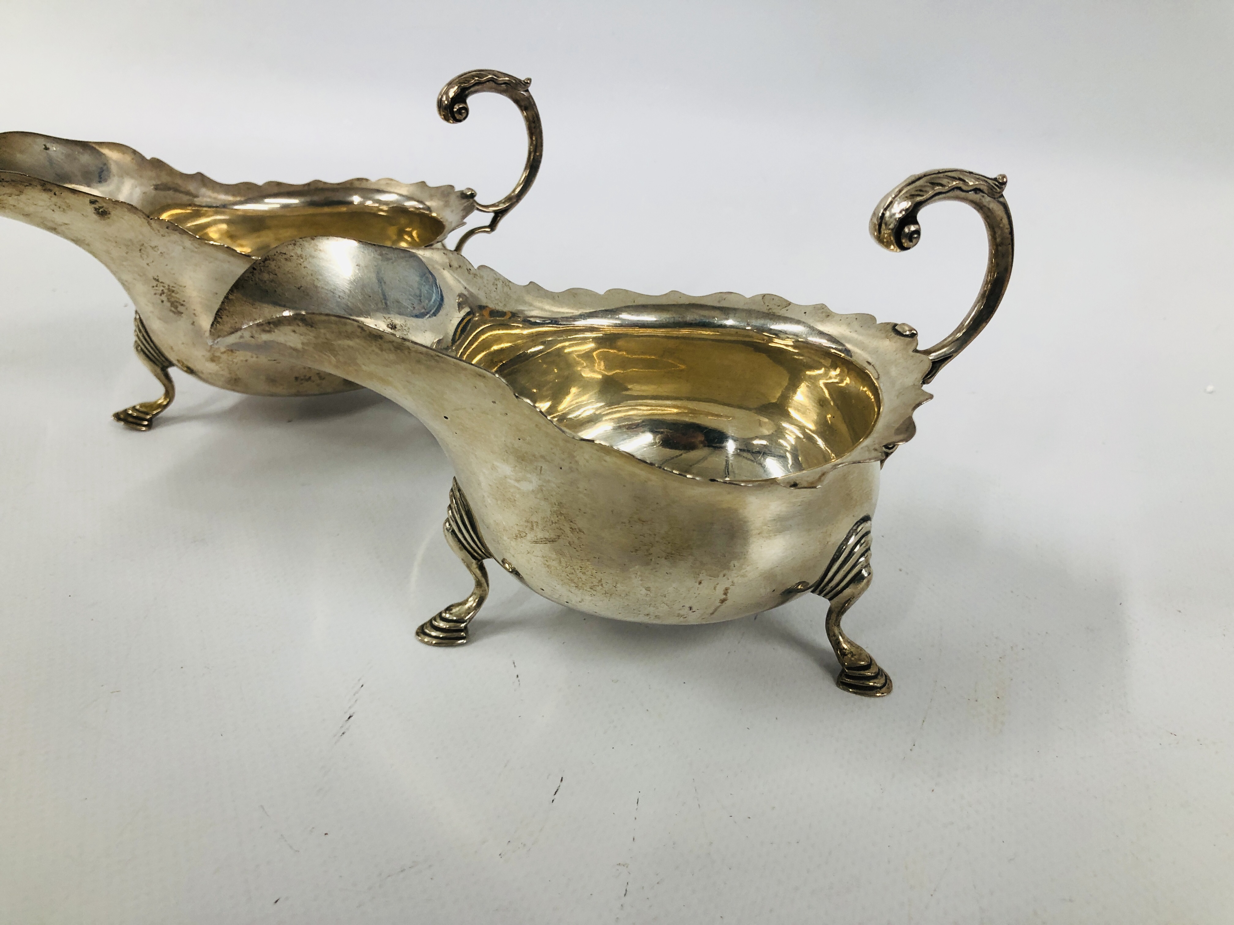 PAIR OF SILVER SAUCE BOATS WITH OPEN SCROLL HANDLE ON TRIPOD HOOF FEET LONDON 1912 LENGTH 16CM. - Image 2 of 11