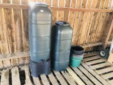 TWO GARDEN WATER BUTTS ALONG WITH SEVEN VARIOUS PLASTIC POTS.