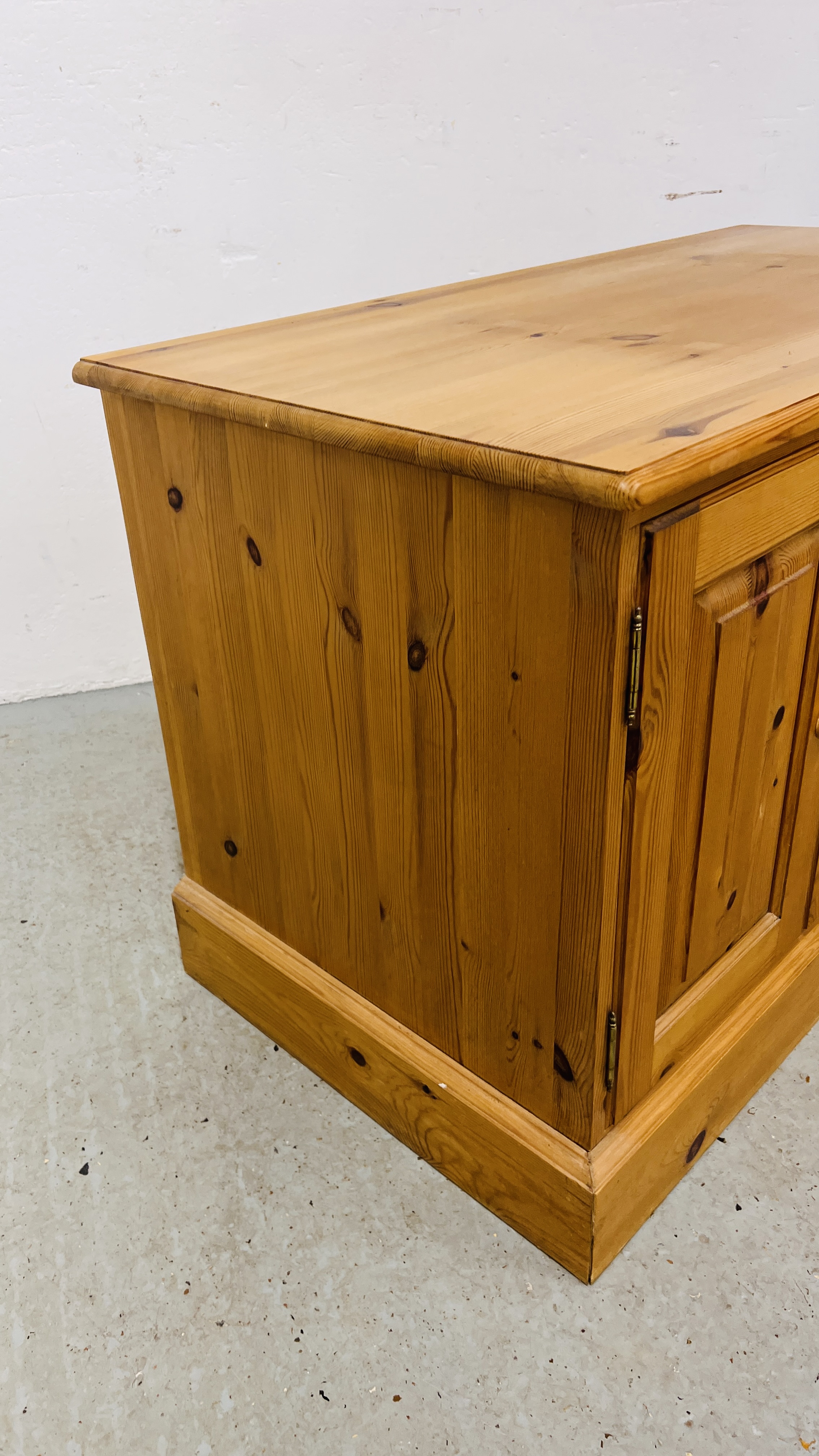 A SOLID WAXED PINE THREE DRAWER ENTERTAINMENT CABINET WIDTH 107CM. DEPTH 54CM. HEIGHT 65CM. - Image 6 of 9