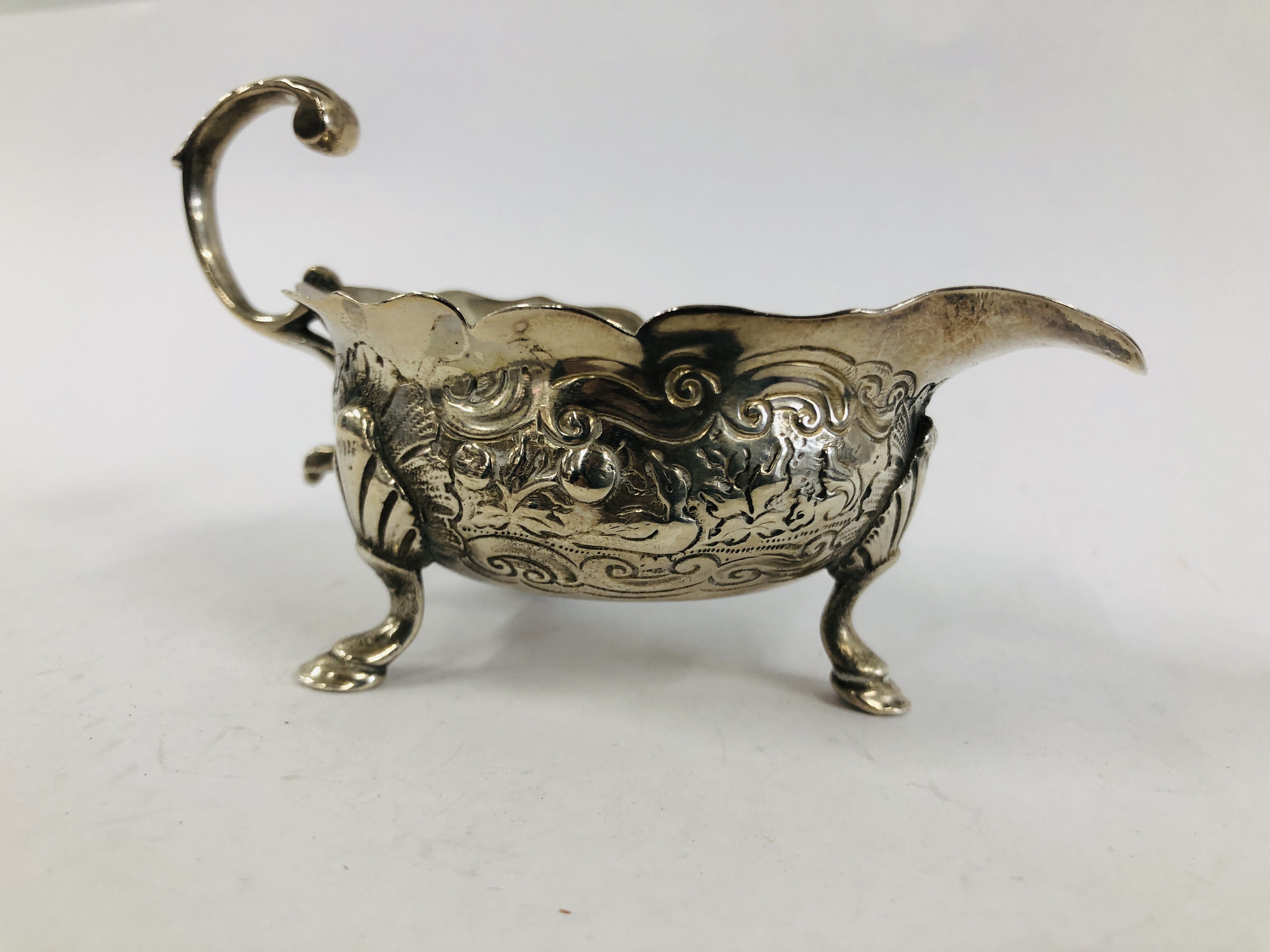 A GEORGE II SILVER CREAM BOAT WITH OPEN SCROLLED HANDLE THE BODY DECORATED WITH GEESE ON TRIPOD - Image 2 of 10