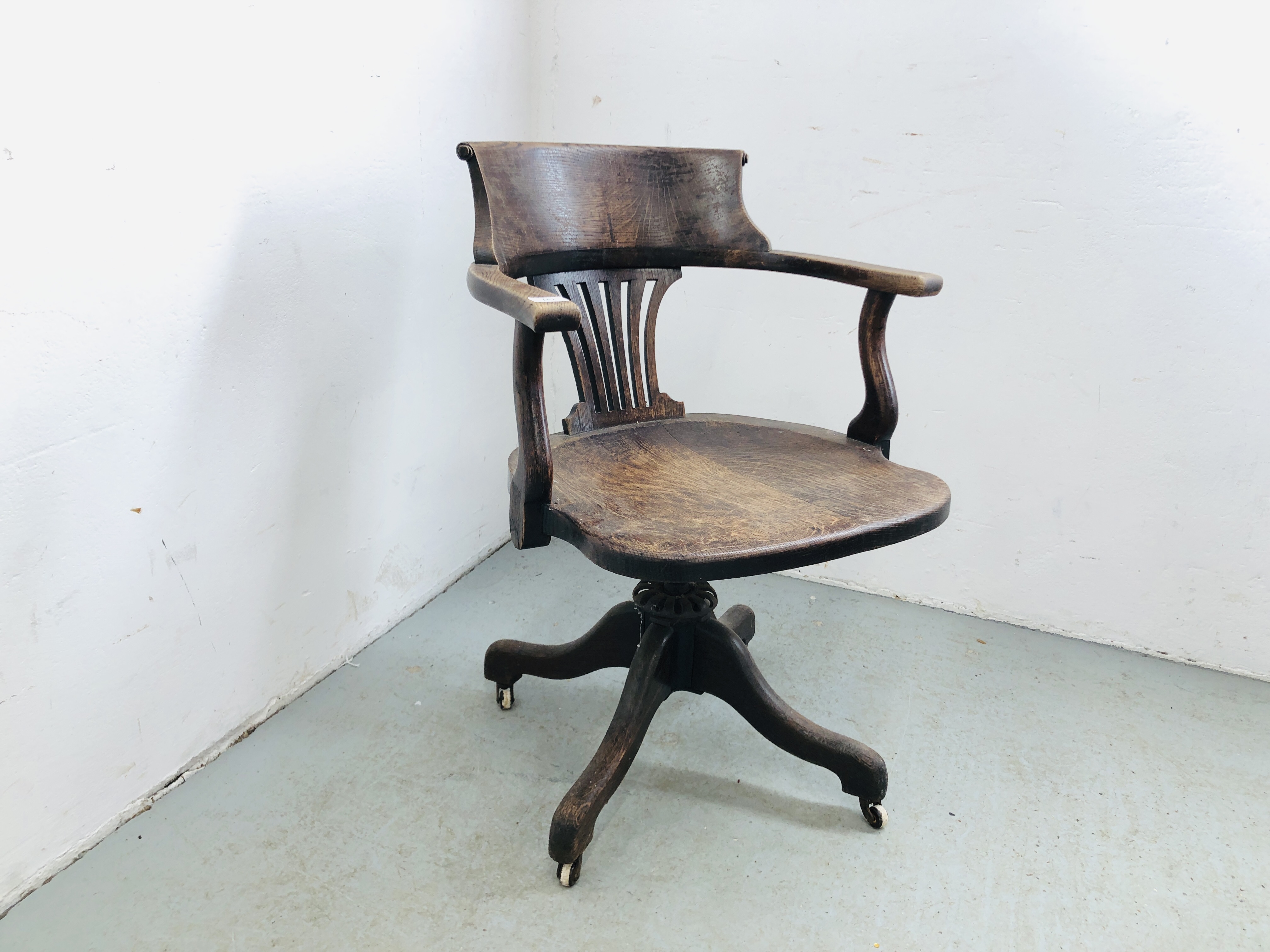 ANTIQUE OAK REVOLVING OFFICE CHAIR WITH MECHANICAL ACTION