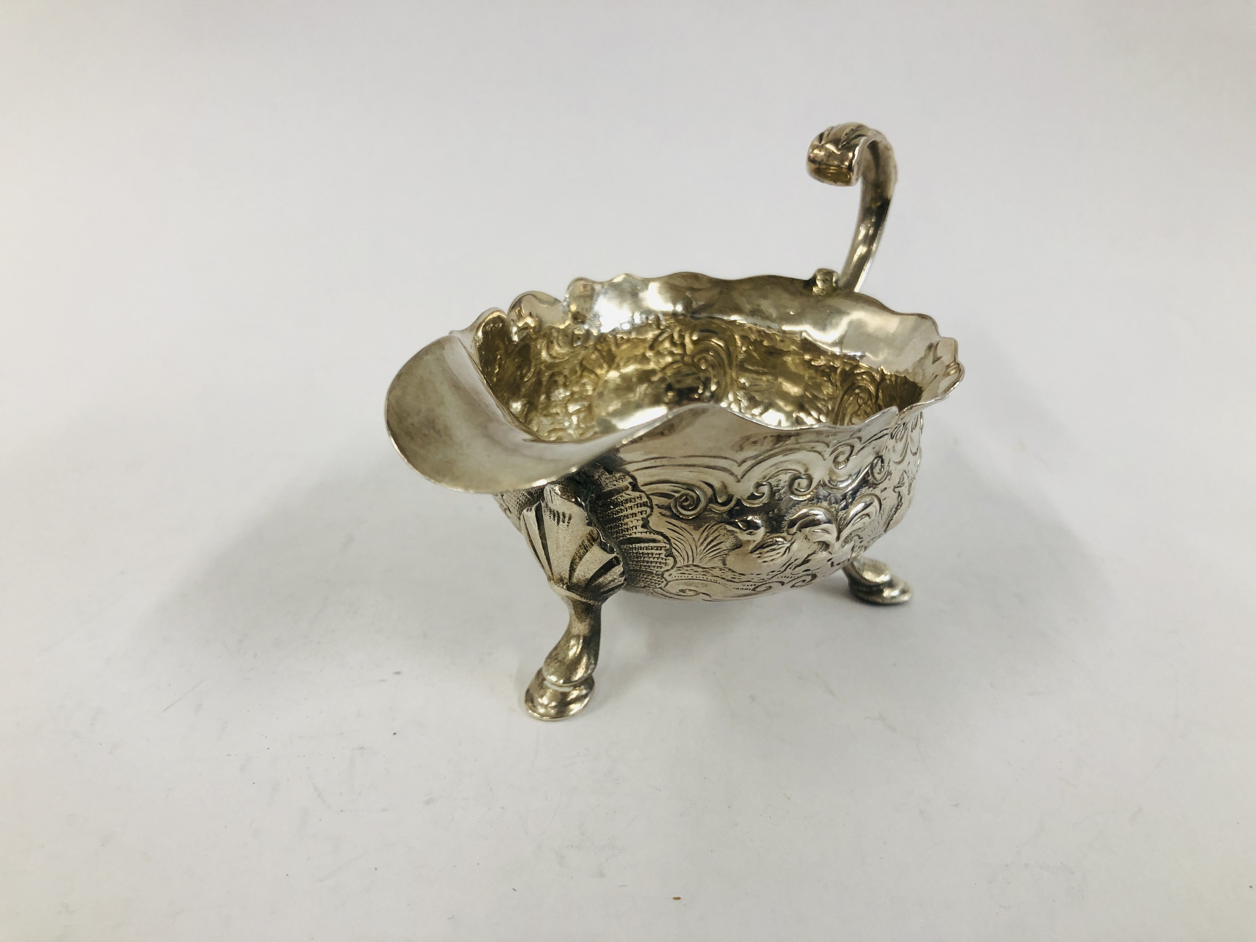 A GEORGE II SILVER CREAM BOAT WITH OPEN SCROLLED HANDLE THE BODY DECORATED WITH GEESE ON TRIPOD - Image 6 of 10