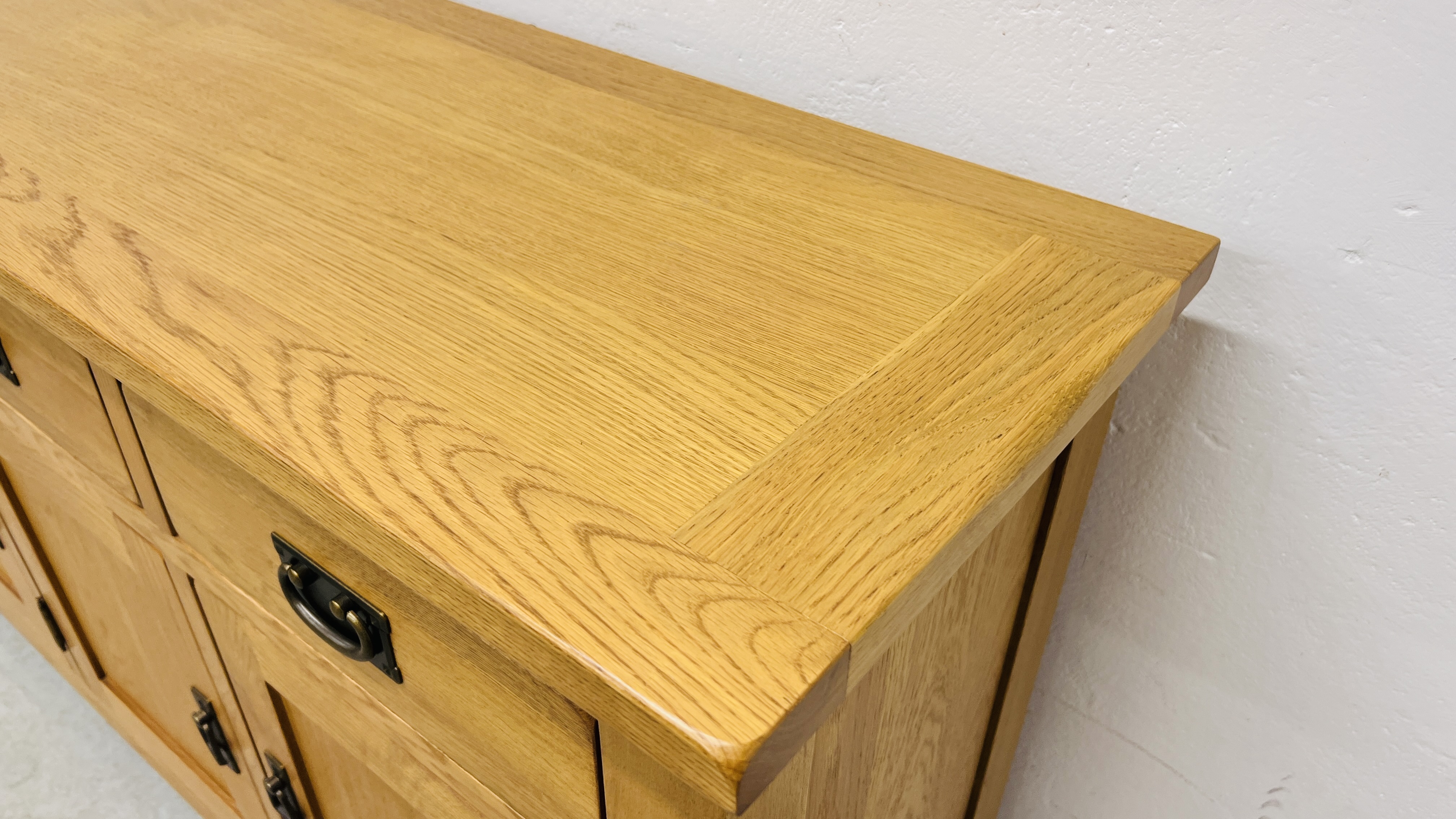 MODERN OAK THREE DRAWER THREE DOOR SIDEBOARD WITH BRASS EFFECT HANDLES WIDTH 139CM. DEPTH 42CM. - Image 6 of 13