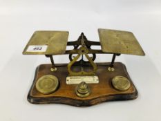 VINTAGE BRASS LETTER SCALE AND WEIGHTS ON A HARDWOOD STAND LENGTH 25CM.