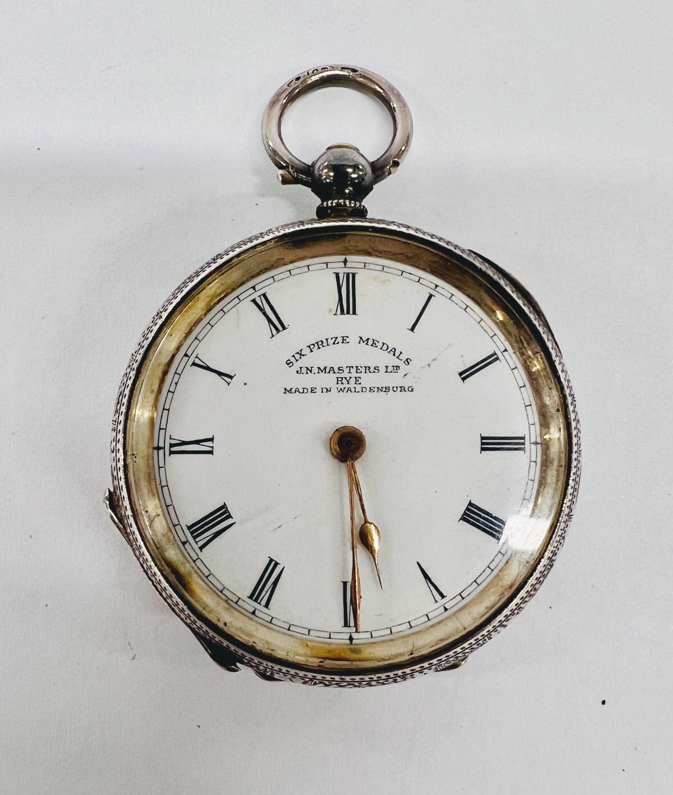 A CONTINENTAL SILVER LADY'S FOB WATCH, KEY WIND WITH WHITE ENAMEL DIAL, RETAILED BY MASTERS LTD,