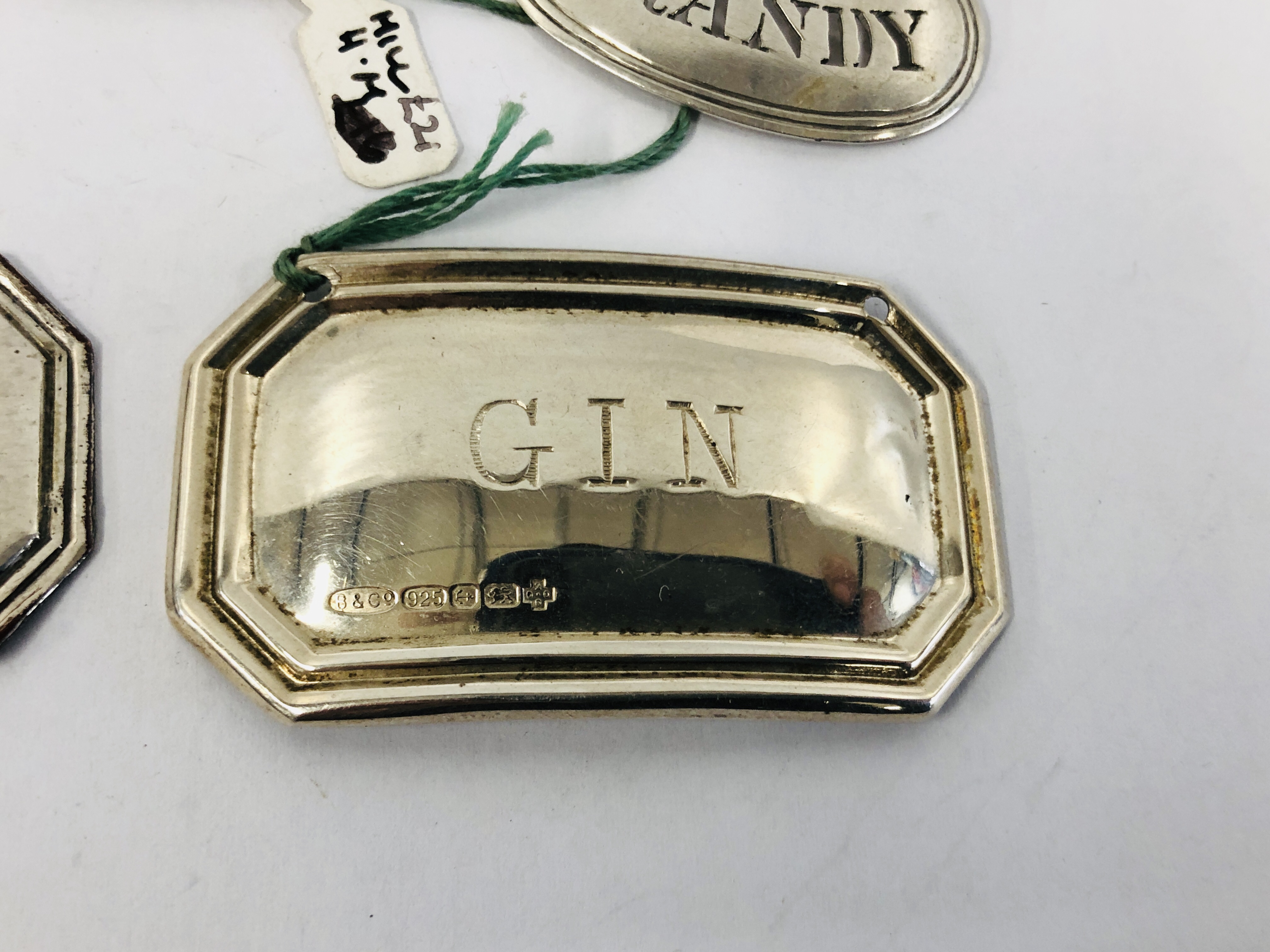 A GROUP OF FOUR SILVER WINE LABELS, BRANDY, HOCK, GIN AND SHERRY ALONG WITH A PLATED EXAMPLE, - Image 4 of 10