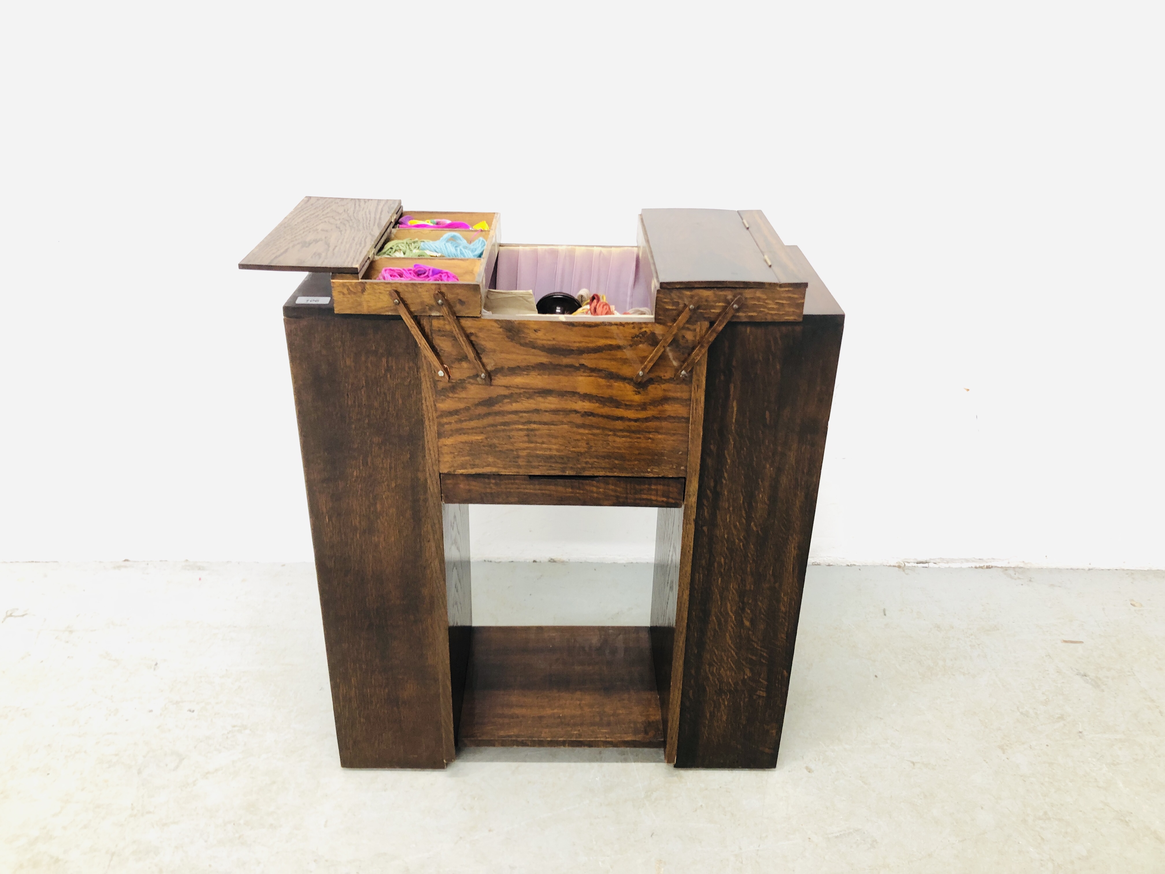 1940'S OAK CANTILEVER COMBINATION SEWING BOX ON OPEN SHELVED BASE