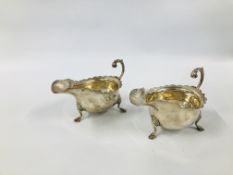 PAIR OF SILVER SAUCE BOATS WITH OPEN SCROLL HANDLE ON TRIPOD HOOF FEET LONDON 1912 LENGTH 16CM.