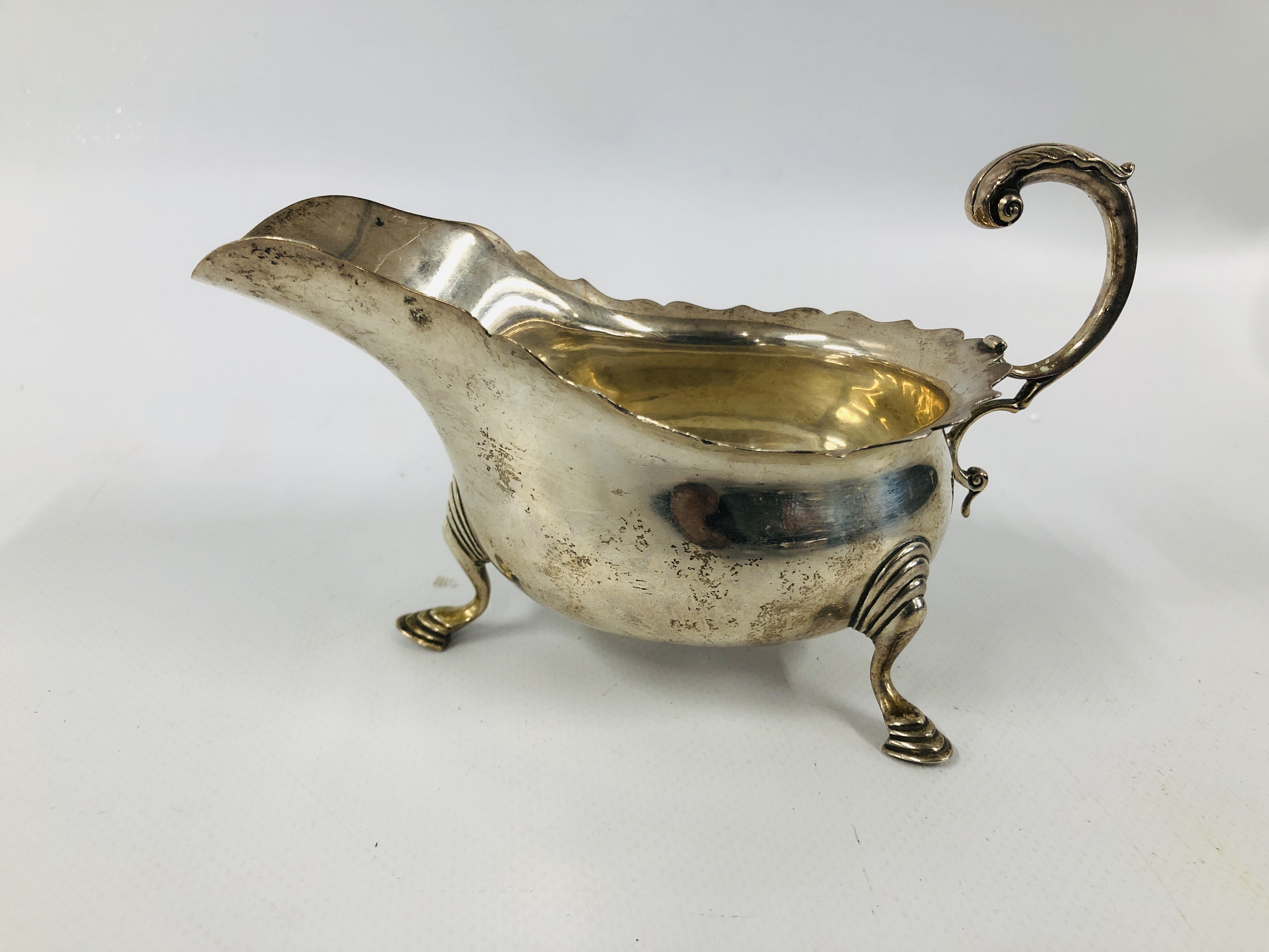 PAIR OF SILVER SAUCE BOATS WITH OPEN SCROLL HANDLE ON TRIPOD HOOF FEET LONDON 1912 LENGTH 16CM. - Image 7 of 11