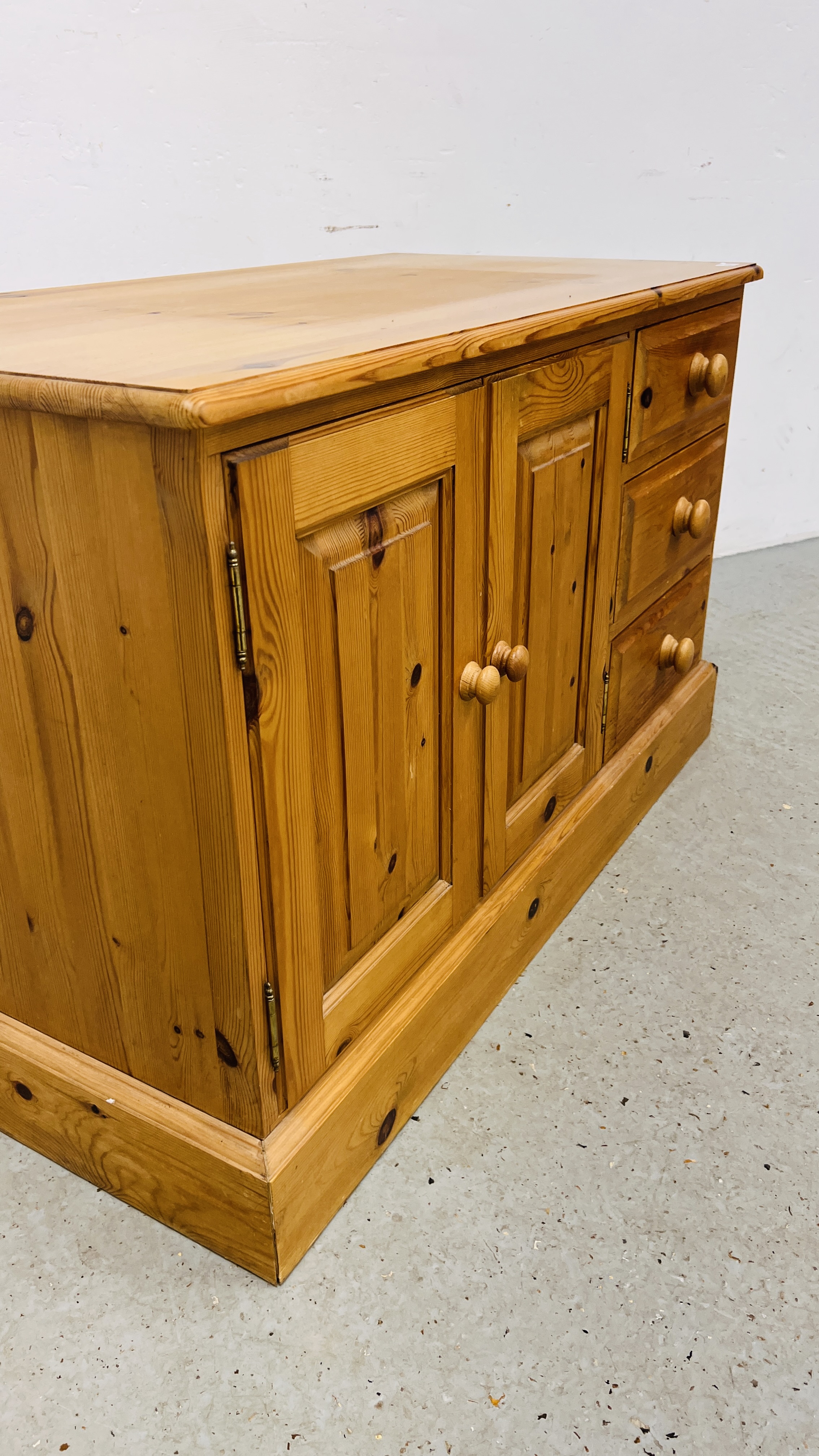 A SOLID WAXED PINE THREE DRAWER ENTERTAINMENT CABINET WIDTH 107CM. DEPTH 54CM. HEIGHT 65CM. - Image 7 of 9