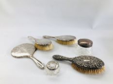 A GROUP OF FOUR SILVER BACKED DRESSING TABLE BRUSHES AND MIRROR,