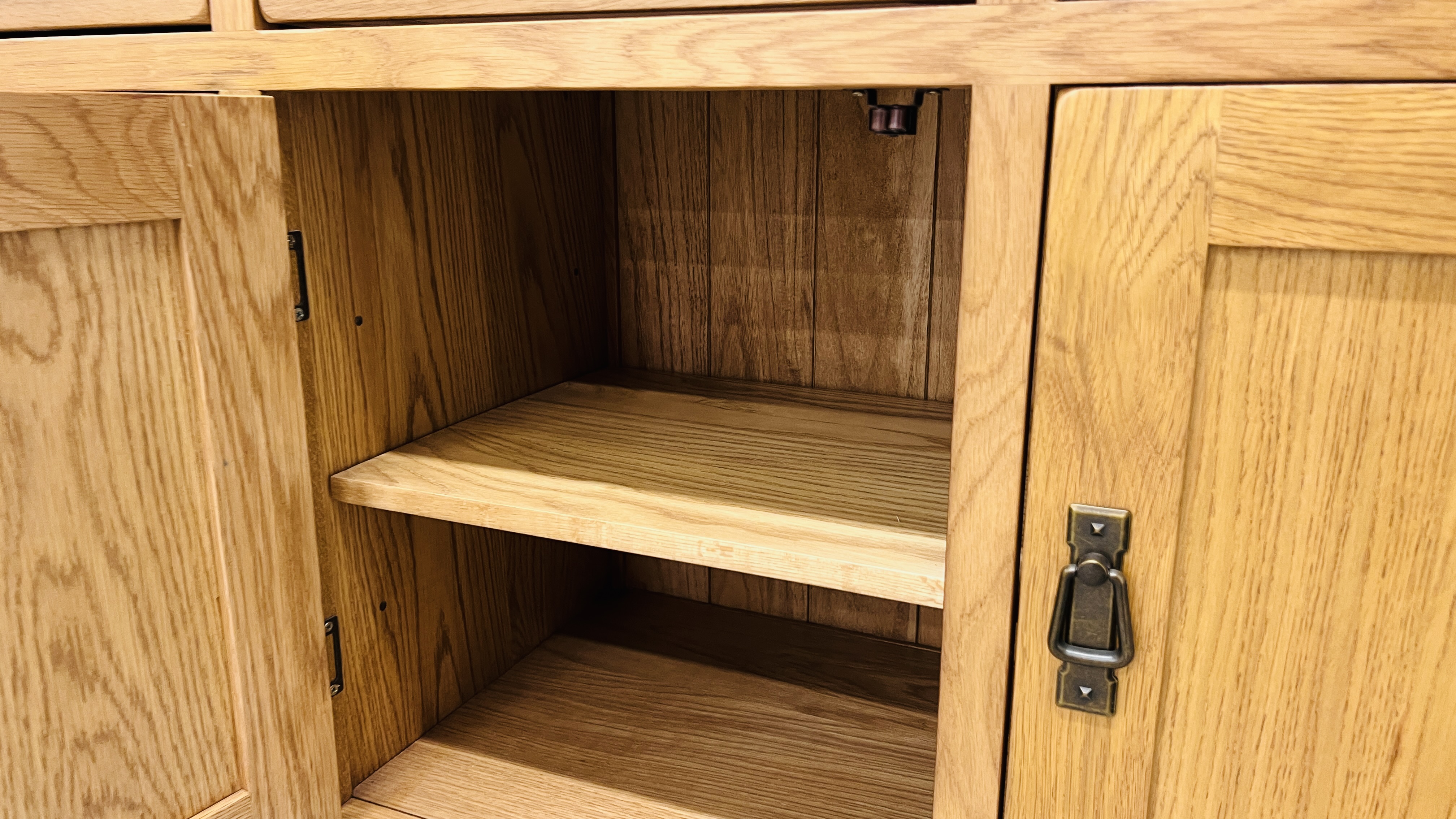 MODERN OAK THREE DRAWER THREE DOOR SIDEBOARD WITH BRASS EFFECT HANDLES WIDTH 139CM. DEPTH 42CM. - Image 13 of 13