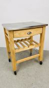 A MODERN SOLID BEECHWOOD FRAMED CHEFS WORKSTATION ON CASTOR WHEELS WITH STAINLESS STEEL WORKTOP,