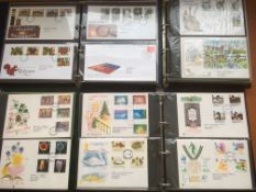 A COLLECTION OF GB FIRST DAY COVERS 1982-96 IN FOUR ALBUMS.