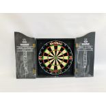 A WINMALL DIAMOND PLUS DART BOARD IN WALL CASE.