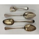 A GROUP OF THREE SILVER SERVING SPOONS,