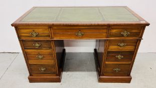 AN EDWARDIAN MAHOGANY NINE DRAWER KNEEHOLE DESK THE TOP WITH GREEN LEATHER WRITING SURFACE WIDTH