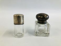 A SILVER MOUNTED GLASS INKWELL, CHESTER 1928 (CORNER CHIP),