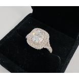 A MODERN CONTEMPORARY RING MARKED 18K WHITE GOLD THE PRINCIPLE BRIGHT CUT DIAMOND MARKED 3.