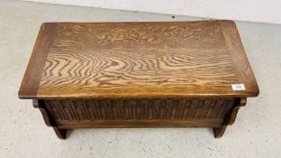 A SMALL REPRODUCTION BLANKET BOX WITH CARVED DETAIL, WIDTH 76.5CM. DEPTH 36CM. HEIGHT 40CM.