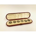 A LEATHER CASED SET OF SIX SILVER BUTTONS, CAST WITH SEATED GODDESS DIANA AND TWO HOUNDS,