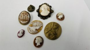 A ROUP OF SIX UNMOUNTED CAMEOS ALONG WITH TWO IN ORNATE MOUNTS