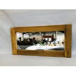 A LARGE OAK FRAMED MIRROR, W 120CM X H 60CM.