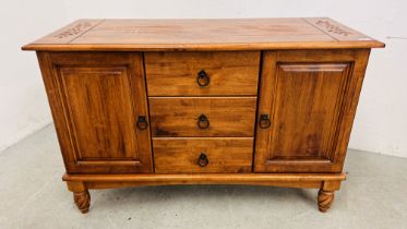 A HARDWOOD TWO DOOR DRESSER BASE WITH THREE CENTRAL DRAWERS WIDTH 122CM. DEPTH 49CM. HEIGHT 79CM.