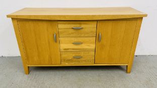 A SOLID OAK THREE DRAWER TWO DOOR SIDEBOARD WIDTH 137CM. DEPTH 45CM. HEIGHT 75CM.