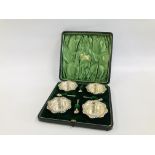 A CASED SET OF FOUR SILVER CIRCULAR SALTS AND SPOONS,