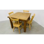 A SOLID OAK EXTENDING DINING TABLE ALONG WITH A SET OF FOUR BEECH WOOD DINING CHAIRS