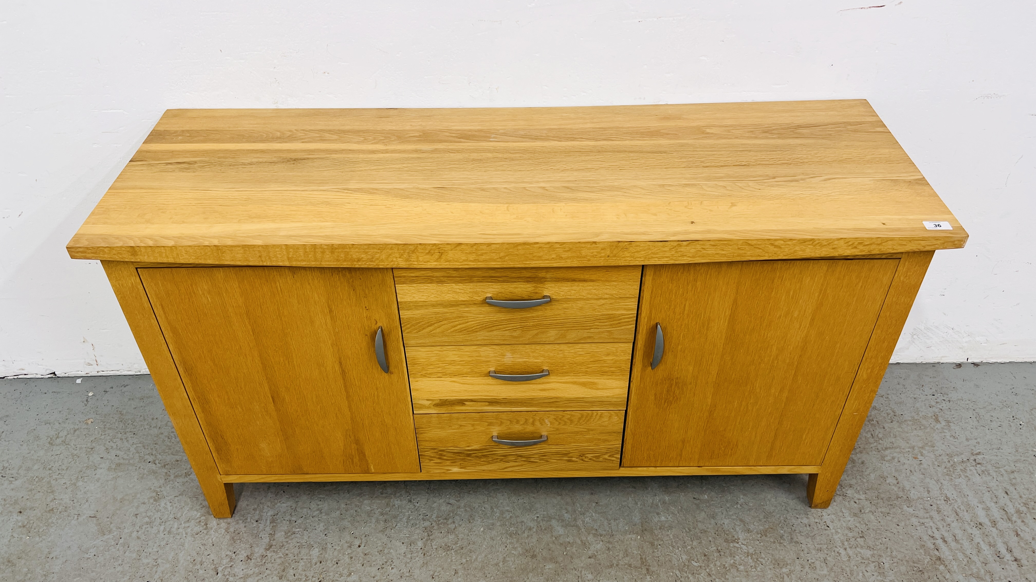 A SOLID OAK THREE DRAWER TWO DOOR SIDEBOARD WIDTH 137CM. DEPTH 45CM. HEIGHT 75CM. - Image 2 of 10