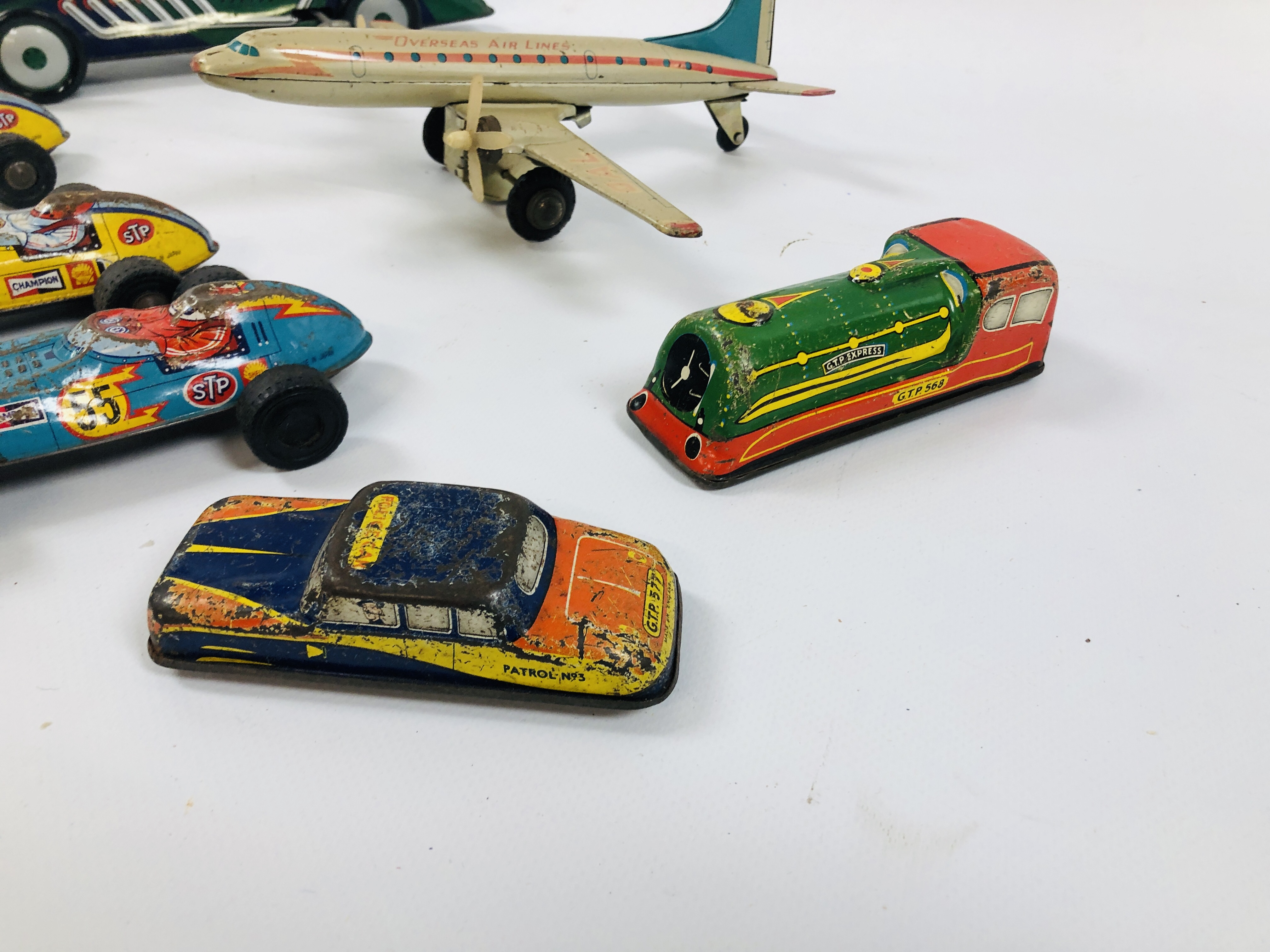 A GROUP OF VINTAGE TIN PLATE CARS, VEHICLES, TRAIN AND A PLANE INCLUDING STP CHAMPION 21, - Image 2 of 6