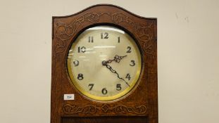 A GERMAN 1930's OAK CASED LONG CASE CLOCK WITH WESTMINSTER CHIME.