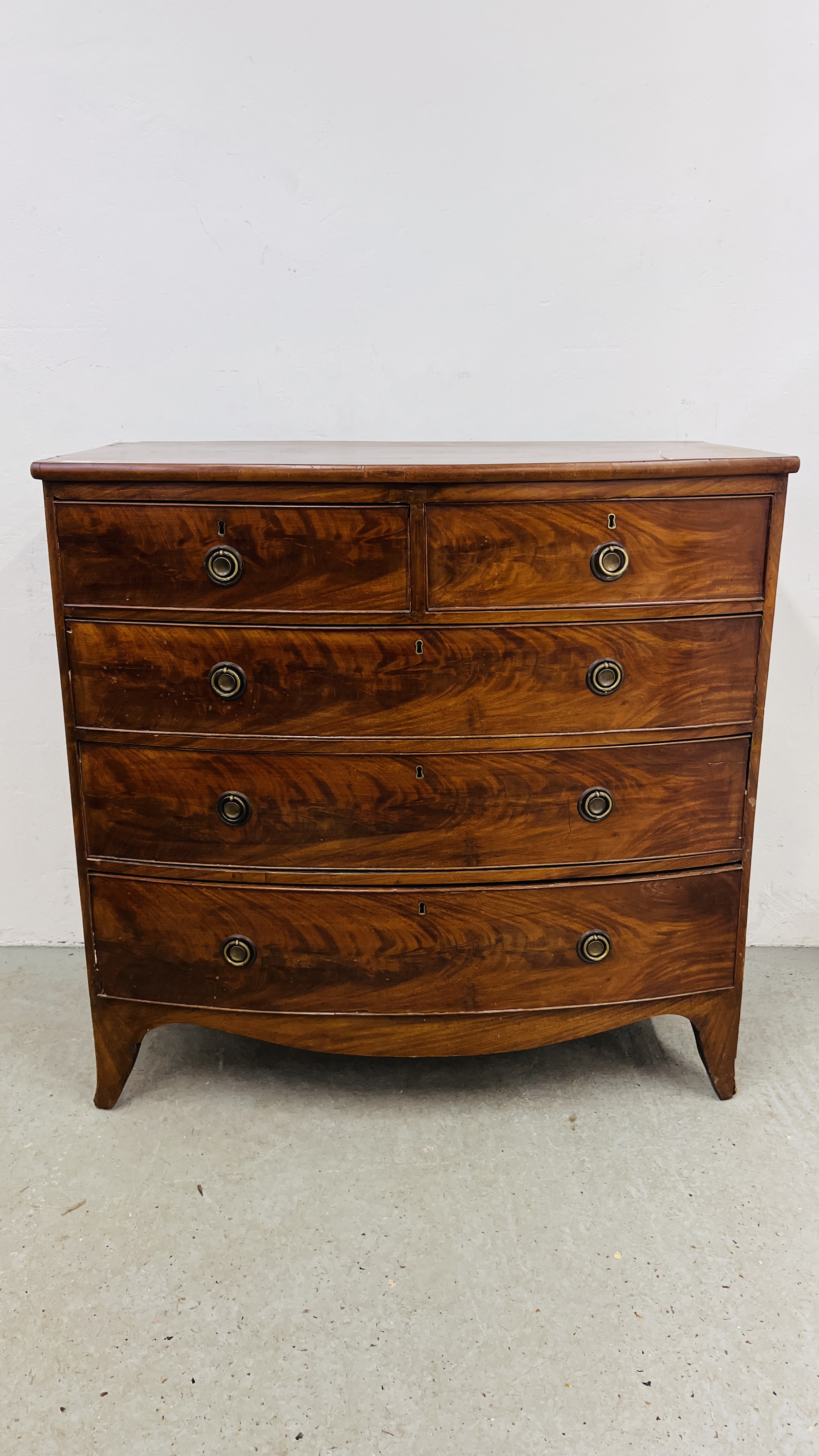 A MAHOGANY BOW FRONTED TWO OVER THREE CHEST OF DRAWERS, W 106CM, D 54CM, H 104CM.