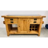 A SOLID OAK MARBLE TOPPED KITCHEN ISLAND WITH TWO SLIDE THROUGH DRAWERS AND SINGLE CENTRAL DOOR,