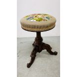 A VICTORIAN REVOLVING RISE AND FALL MUSIC STOOL,